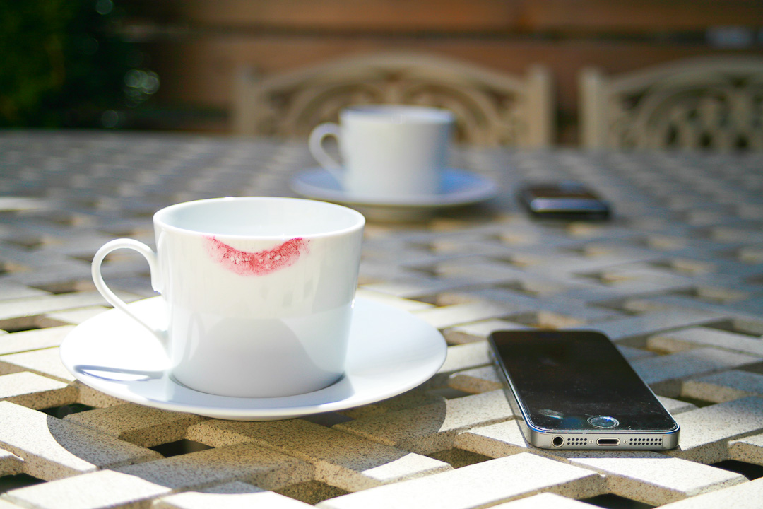 Image Of Cups And Saucers With Smartphones