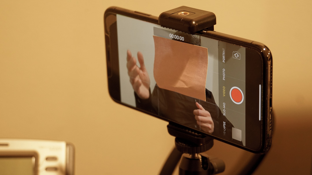 Image Of Someone Recording A Social Media Video With A Sticky Note Covering Their Face On The Smartphone Screen